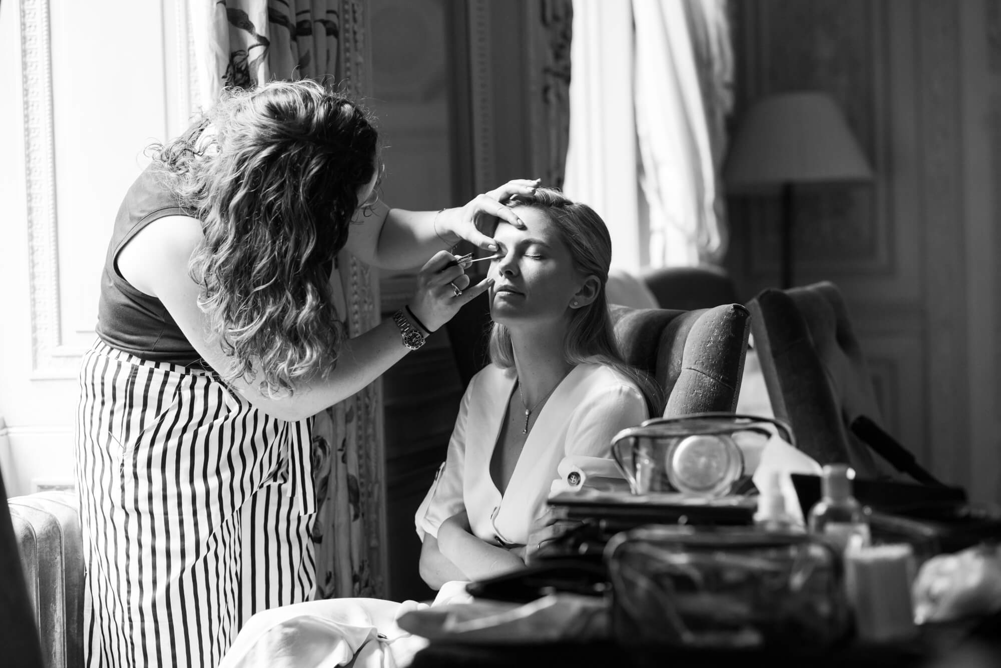 A bride having her hair and make up done by Lillie Lindh at Dartmouth house in Mayfair London